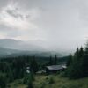 Modern off-grid cabin powered by rooftop solar panels in a forest