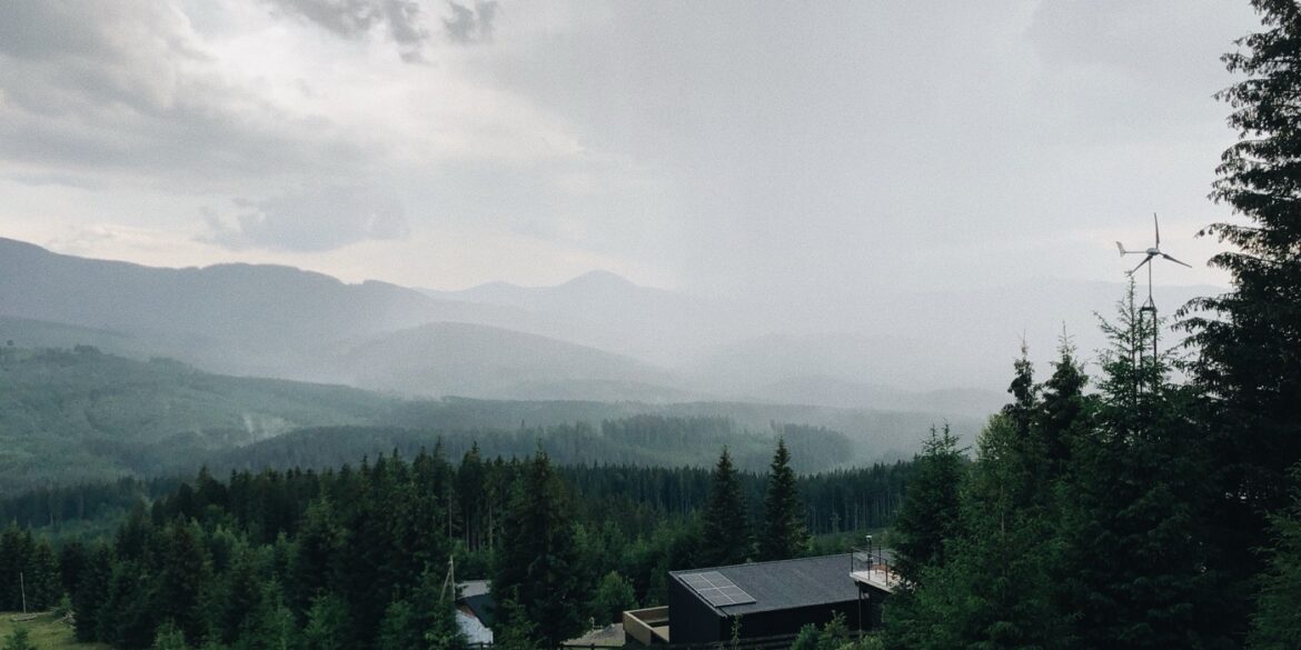 Modern off-grid cabin powered by rooftop solar panels in a forest