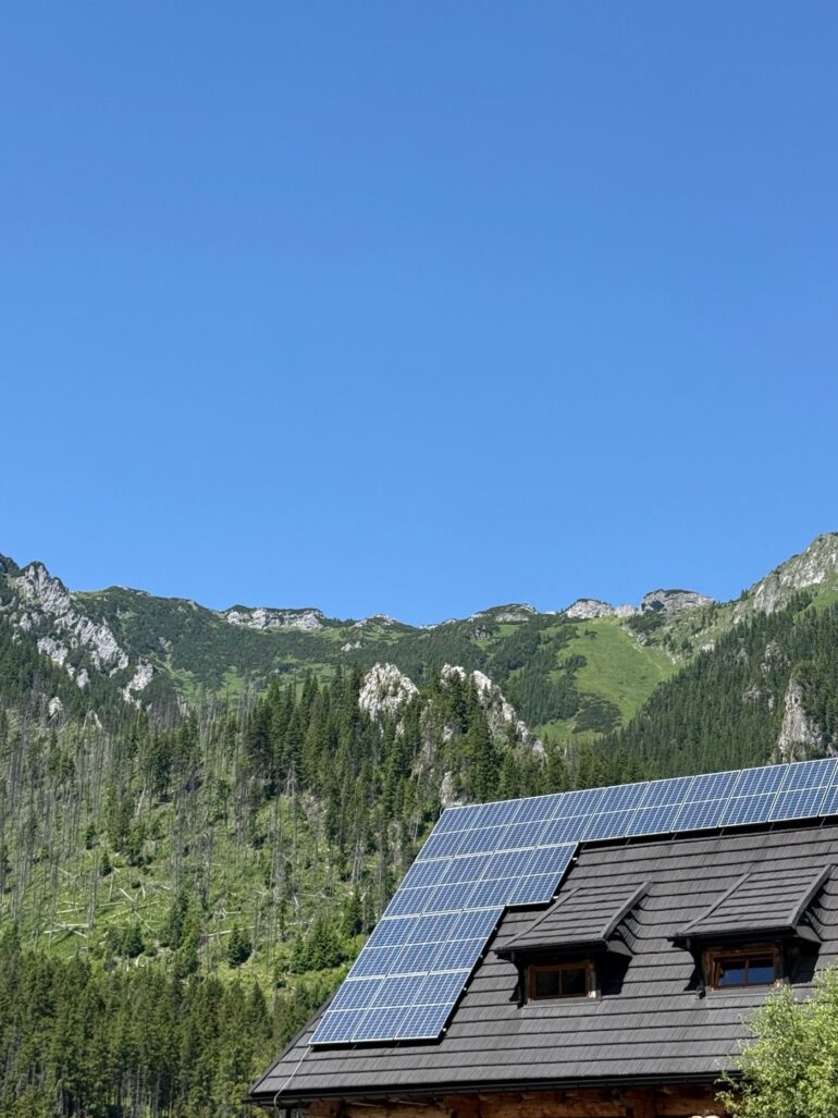 Remote mountain home designed for off-grid living powered by solar panels.